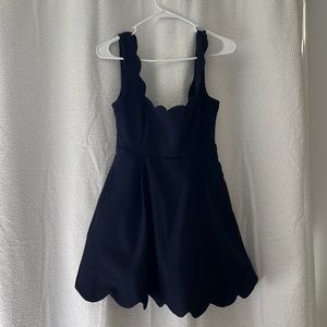 Navy mini dress with scalloped edges